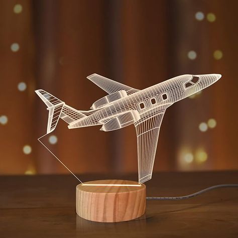 The Winter holiday season is already upon us and during this, many are trying to get ideas on what to buy their loved ones. With that said, here are ten great gift ideas for young aviation geeks and aspiring pilots. Ranging from mugs to remote-controlled paper airplanes, this list has it all. Plane Room Decor, Plane Room, Rocket Lamp, Plane Gifts, Metallic Spray Paint, 3d Illusion Lamp, 3d Night Light, Pilot Gifts, 3d Illusion