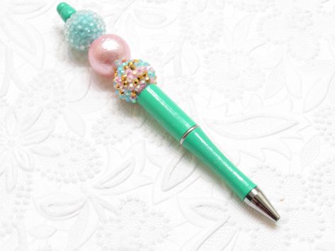 NEW Bubblegum Beadable Pen Blanks, Lightweight Mint Pen, Black Ink,DIY Plastic Beadable Pens, Plastic Pens, Use 3 Bubblegum Beads to Decorate. More colors available soon. NOTE Beads not included Size: 20mm Color: Mint Material: Plastic Quantity: 3 pen Size: Pens are six inches inches long with approximately 3.5 inches of beading. Ink Color: Black We used Bubblegum Beads with a 2.00mm plus Hole The pen unscrew from the top so you can add the beads in the color of your choice. Typical 3 of the 20m Pen Ideas, Beadable Pens, Keychain Craft, Pen Diy, Halloween Bracelet, Pen Blanks, Beadable Products, Bubblegum Beads, Tassel Keychain