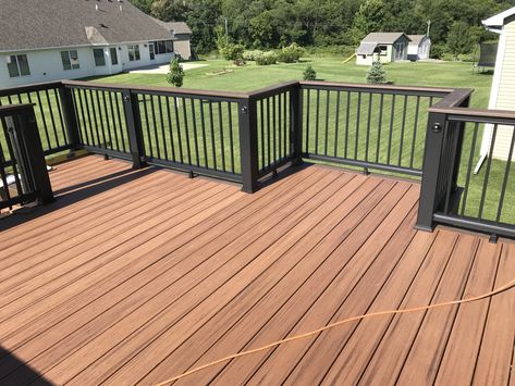 Deck Staining Ideas Two Tone, Deck Stain With Black Railing, Brown And Black Deck Ideas, Deck Stain Black Railing, Wood Deck With Black Railing, Dark Brown And Black Deck, Dark Stained Deck With Black Railings, Two Tone Deck Color Ideas, Brown Deck Black Railing