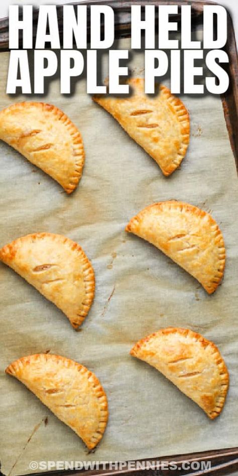 Baked Apple Hand Pies Easy Pillsbury, Baked Hand Apple Pies, Oven Baked Apple Hand Pies, Easy Small Apple Pies, Hand Pie Desserts, Mini Hand Pies Recipes, Easy Apple Hand Pies With Pie Crust, Baked Apple Hand Pies Recipes, Homemade Hand Pies Crust Recipe