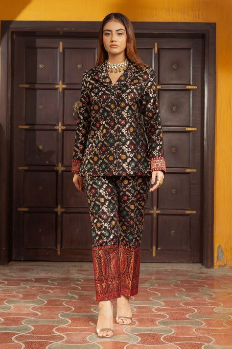 Black woven moonga silk blazer with multi color floral jaal pattern and notched collar. Paired with pants.
Component: 2
Pattern: Woven
Type Of Work: Floral Jaal Pattern
Neckline: Notched Collar
Sleeve Type: Full Sleeves
Fabric: Moonga Silk, Lining: Satin
Color: Black,Multi Color
Other Details: 
Red contrast paisley borders
Front button closure
Attached lining
Occasion: Party,Cocktail - Aza Fashions Trending Indo Western Outfits, Marriage Outfit, Long Blouse Designs, Cocktail Party Outfit, Mangalsutra Design, Silk Blazer, Brocade Dress, Indian Gowns, Dress Indian Style