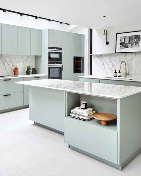 This fresh mint-green kitchen is the epitome of modern design featuring high-tech appliances and smooth green cupboards, thoughtfully designed to elevate culinary experiences! #scandikitchen #homeinspo #luxurykitchens https://www.solakitchens.com/serene-green/ Elegant Kitchen Design Modern, Pastel Kitchen Ideas, Dekton Bergen, Green Cupboards, Mint Green Kitchen, Scandi Kitchen, Black Window Frames, Off White Kitchens, Elegant Kitchen Design