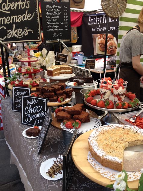 Cake stall at Camden Lock Market, London  Love the use of strawberries for extra colour! Brownie Stall Display Ideas, Cake Market Stalls, Baking Stall Display Ideas, Food Market Stall Display Ideas, Bakery Stall Display, Cake Stall Display Ideas, Market Stall Display Ideas Food, Cake Stall Ideas, Food Stall Ideas