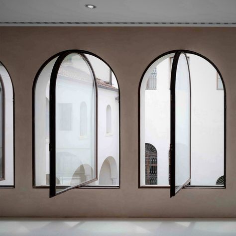 Black steel framed windows with arched heads Arch Window Interior, What To Do With Arched Windows, Arched Steel Windows, Arched Window Design, Modern Arch Window, Modern Arched Windows, Arch Windows Exterior, Arched Windows Exterior, Arch Window Design