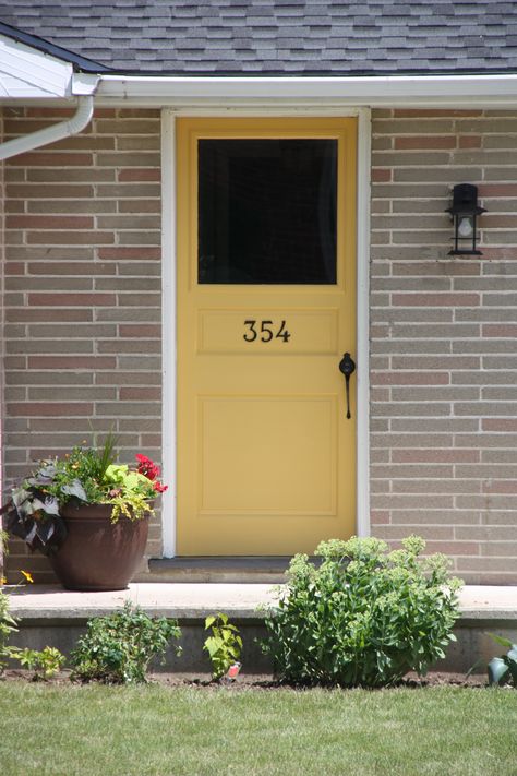 Perfect color for my front door... BM Stuart Gold Colors For Front Doors, Gold Front Door, Yellow Front Door, Farmhouse Front Porch Decor, Exterior Door Colors, Front Door Ideas, Yellow Front Doors, Yellow Paint Colors, Black Shutters