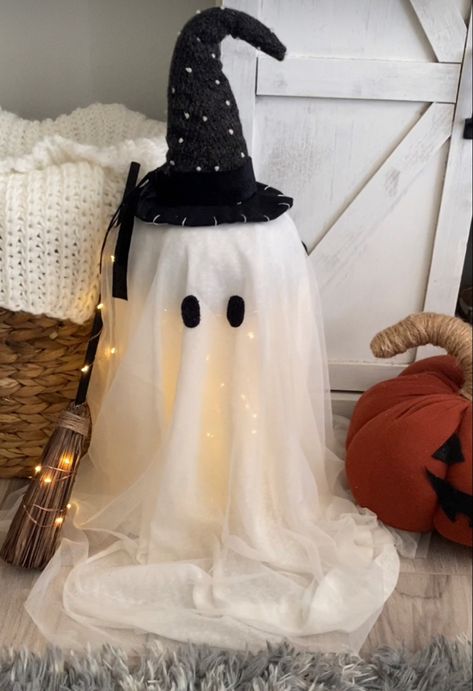 Witch ghost I made using a vase, a fabric pumpkin, some white sheer fabric, black sherpa, fairy lights, and tulle. Witch Ghost, Fabric Pumpkins, Fabric Black, Sheer Fabric, Sheer Fabrics, Fairy Lights, Ghost, Witch, Vase