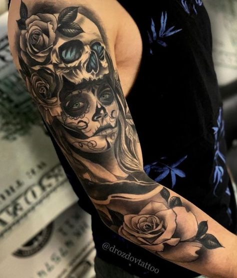 The Best Sleeve Tattoos Of All Time - TheTatt Upper Arm Skull Tattoo, Upper Arm Sleeve Tattoos For Guys, Half Sleeve Tattoos For Men Upper Arm, Mexican Tattoo Ideas For Men, Bicep Tattoo For Guys Inner, Dead Tattoo, Catrina Tattoo, Skull Girl Tattoo, Skull Sleeve Tattoos