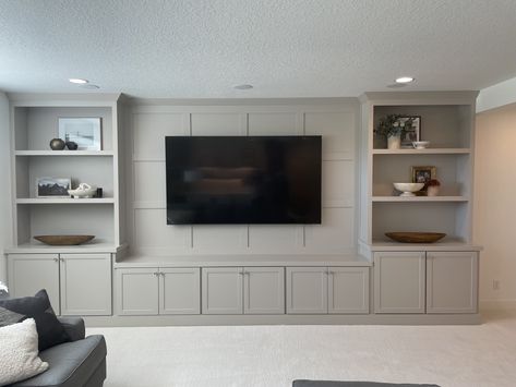 Bonus Room Cabinets, Custom Built Media Wall, Finished Basement Tv Wall, Cabinets Around Tv, Tv Feature Wall With Storage, Built In Under Tv, Built In Tv Wall Unit Basement, Basement Tv Wall Ideas With Fireplace, Multiple Tv Wall