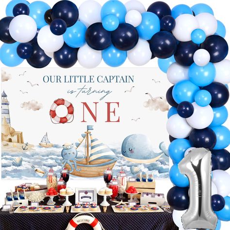 PRICES MAY VARY. Nautical Party Decorations for 1st Birthday: Include 1pc our little captain is turning one backdrop 5*3 ft, 54pcs latex balloons 12”, 15pcs latex balloons 5”, 1pc number 1 foil balloon 32”, 1pc balloon tape strip, 1 roll of adhesive dots and 2pcs ribbons. High Quality: Nautical first birthday party decorations are made of premium latex, foil and vinyl, sturdy and durable. Unique Design: Our little captain is turning one backdrop is designed as cute nautical themed patterns, matc Nautical First Birthday Party, Pirate 1st Birthday Party, Sailing Into One Birthday, Nautical Birthday Decorations, Nautical First Birthday, Sailor Birthday, First Birthday Theme, Ocean Sailing, Baby Boy 1st Birthday Party