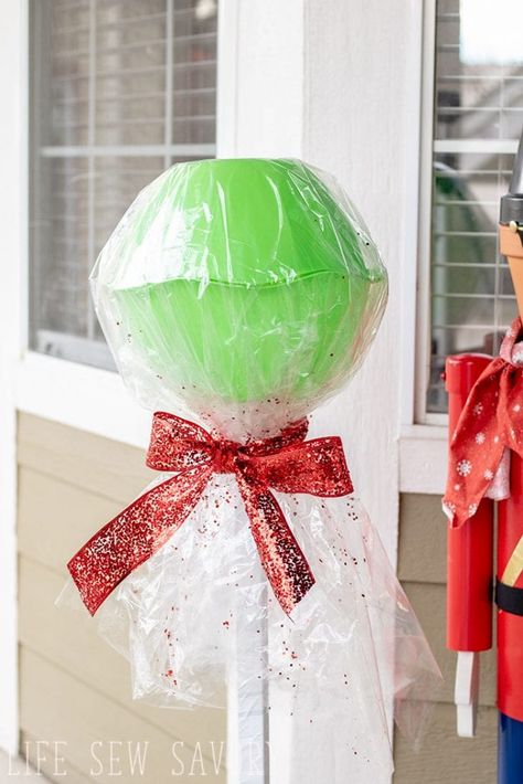 Giant candy decorations Large Candy Decorations, Giant Candy Decorations, Diy Giant Lollipops, Candy Props, Lollipop Decorations, Christmas Parade Floats, Candy Decorations Diy, Giant Lollipops, Diy Christmas Candy