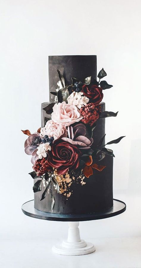 Black cake with a moody floral cascade If classic white wedding cake is not for you, try black wedding cake. Black wedding cake can... Wedding Cake Dark, Black Wedding Cake, Wedding Cake With Flowers, Burgundy Wedding Cake, Dark Wedding Theme, Cake With Flowers, Wedding Color Pallet, Black Cake, Black Wedding Cakes