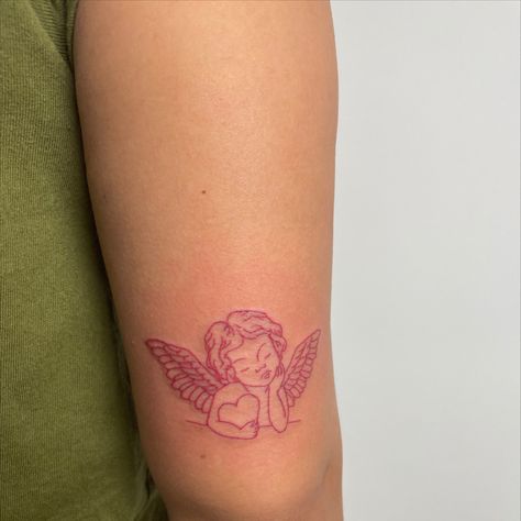 Cherub Tattoo Cherub Rib Tattoo, Red Ink Angel Tattoo, Angel Cupid Tattoo, Cinnamon Girl Tattoo, Red Angel Tattoo, Angel And Devil Tattoo, Cherub Angel Tattoo, Cherub Tattoo Designs, Ny Tattoo