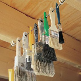 Hang brushes on a rod or wire for out of the way storage Paint Brushes And Rollers, Shed Organization, Organisation Hacks, Garden Tool Storage, Workshop Organization, Garage Storage Organization, Garage Tools, Shop Organization, How To Make Paint