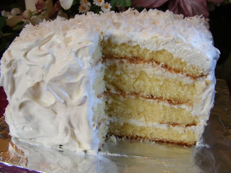 VERY MOIST!!!  Calling all coconut cake lovers! This one is for you!  The secret to this cake is the use of frozen coconut (because of its wetness), the blend of sour cream and the required refrigeration time.  Also, the use of the real butter yellow  cake mix, not a white cake mix. A true winner for flavor and moistness.  My granddaughter requested a coconut cake for her birthday.  I remembered that this was the popular recipe my mother used in the 1960s for her coconut cake.  To get the bes... Cream Coconut Cake, Coconut Sour Cream, Sour Cream Coconut Cake, Passion Cake, Coconut Pineapple Cake, Passionfruit Curd, Coconut Cream Cake, White Chocolate Cake, Coconut Cake Recipe