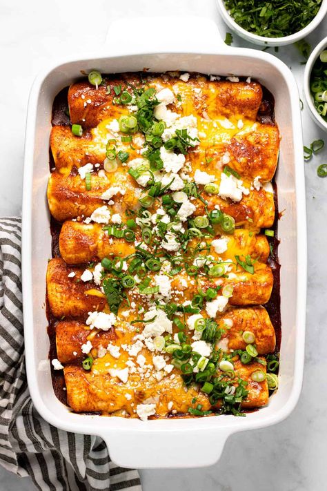 These vegetarian enchiladas are loaded with protein, fiber, and fresh flavors! This is the easiest enchilada recipe you’ll find on the internet. Combine filling ingredients, roll enchiladas and bake! Your family won't even miss the meat, I promise. Corn And Bean Enchiladas, Enchiladas Veggie, Corn Enchiladas, Bean And Cheese Enchiladas, Enchiladas Recipes, Green Enchiladas, Easy Enchilada Recipe, Veggie Enchiladas, Hispanic Dishes