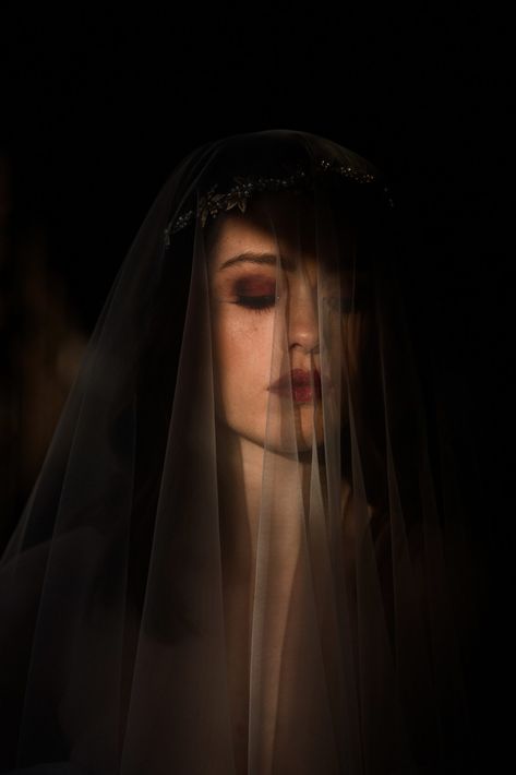 Bride pictured wearing a veil lit by golden sunlight on her face. Dark, winter wedding makeup inspiration. Civic House Glasgow Wedding Dress Editorial » Zoe Alexandra #winterweddinginspiration #winterwedding #bride #artisticbridalportraits Dark Wedding Pictures, Dark Wedding Photoshoot Ideas, Dark Wedding Photoshoot, Moody Wedding Inspiration, Witch Bride, Dark Romantic Photography, Dark Bride, Dark Wedding Photos, Dark Bride Photoshoot