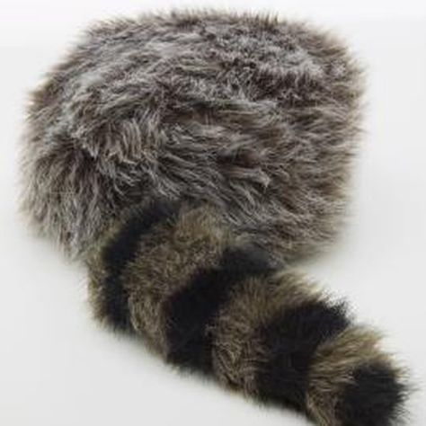 To make your Davy Crockett costume authentic, include accessories such as a coonskin cap. How To Make A Coonskin Hat, Davey Crockett Costume, Davy Crockett Costume, Diy Racoon Costume, Wolf Hat Pattern, Crochet Pattern For Skunk Hat, Fur Hat Pattern, Davy Crocket, Lost Boys Costume