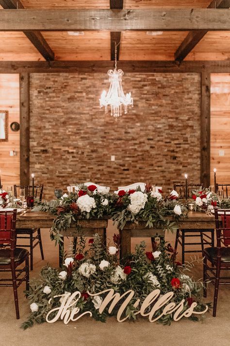 Christmas Inspired Wedding Decor, Christmas Bride And Groom Table, Christmas Head Table Wedding, Red And White Rustic Wedding, Rustic Christmas Wedding Centerpieces, Christmas Western Wedding, Christmas Sweetheart Table, Rustic Winter Wedding Centerpieces, Large Head Table Wedding