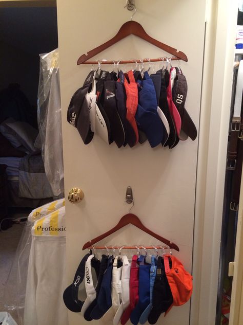 Need some organization for all those hats and visors?! No drilling and no hammering! All you need is a Command decorative hook, a wooden hanger, and a set of shower curtain rings. Better and cheaper than ANY hat holder or organizer you will find on the market.  No closet door to hang it on? Just hang the hanger with caps in the closet. Happy Hanging!! Hat Organization Closet, Winter Hat Outfit, Closet Curtain, Over The Door Hanger, Curtain Ring, Womens Slouchy Beanie, Closet Curtains, Organization Closet, Closet Hacks