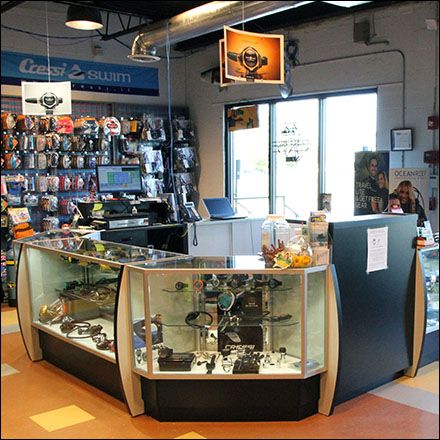 The Dive Rite® cashwrap is the checkout, service, and sales command center for this specialty retailer. Facing inward it allows staff to guide entrants and give instant advice and consultation to t... Scuba Shop, Fishing Store, Scuba Diving Equipment, Dive Shop, Diving Equipment, Diving Center, Shop Layout, Container House Design, Store Interior