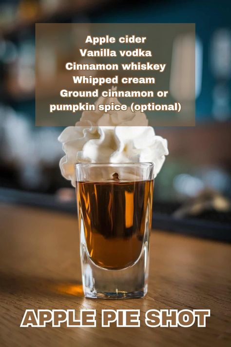 A spiced Apple Pie Shot topped with whipped cream and a cinnamon stick garnish. Thanksgiving Shots Recipes, Fall Shot Recipes, Apple Pie Shots Recipe, Fall Alcoholic Drinks For A Party, Holiday Shot Recipes, Caramel Apple Shots, Fall Shots, Apple Pie Shots, Holiday Shots