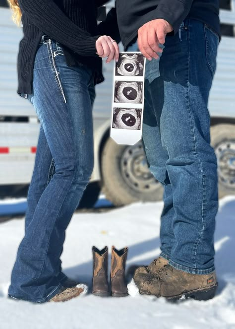 My sister wanted cute photos to announce her pregnancy that also tied into their every day lives. We came up with the idea to use some tiny cowboy boots to represent the baby since they live on a working farm! Maternity Photography Cowboy Boots, Cute Baby Announcements For Husband, Country Baby Announcing Ideas, Baby Announcements Ideas, Pregnancy Announcement Country, Western Baby Announcement Photos, Western Baby Gender Reveal Ideas, Country Pregnancy Outfits, Cowboy Baby Announcement