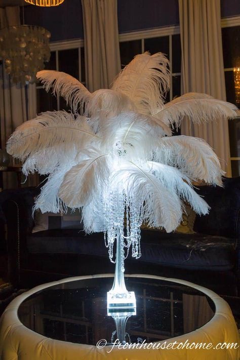 Learn how to make this glam DIY feather centerpiece that will turn your wedding or party into a really special event without breaking your budget. #entertainingdiva #feathercenterpieces #babyshower #bridalshower #centerpieces #newyearseve #partyideas Ostrich Feather Centerpieces, Diy Feather, Feather Bouquet, Eiffel Tower Vases, Tower Vase, Feather Centerpieces, Bouquet Holder, Mini Led Lights, Great Gatsby Party