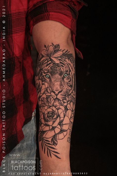 The tiger represents strength, passion, and fierceness, while the flowers in this tattoo symbolize love and natural beauty. It shows how you are and should strive to achieve your goals with all your fierceness. Both these meanings combined remind and show you that it is important to be fierce in a world with so much competition and bad vibes. #tigertattoo #tigeresstattoo #tigereye #flowertattoos #rosetattooideas #tigerandflowertattoo #realictictigertattoo #tigerandfloraltattoo #tattoosforwomen Tiger Flower Tattoo, Flower Tattoo Men, Tiger Flower, Ma Tattoo, Latest Tattoos, Tattoo Care, Bad Vibes, Tiger Tattoo, Tattoo Trends