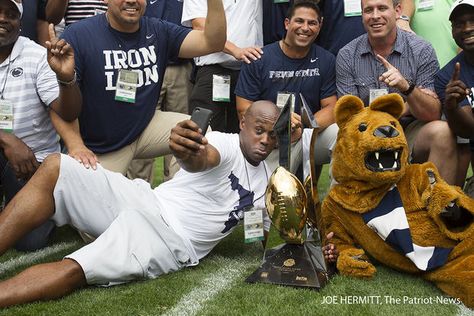 PENN STATE – FANS AND ALUMNI – Ki-Jana Carter snaps a selfie with the Rose Bowl trophy as the undefeated 1994 Penn State is honored at half time at Beaver Stadium, September 6, 2014. Penn State beat Akron, 21-3. Joe Hermitt, PennLive Beaver Stadium, Penn State Football, Bleed Blue, Pennsylvania State University, Penn State University, Lion Pride, Half Time, Team Photos, Rose Bowl