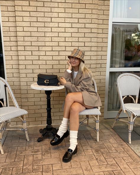 Black loafers with a Burberry bucket hat and tan blazer Trendy Luxury Bucket Hat With Short Brim, Tan Bucket Hat Outfit, Burberry Hat Outfit, Chanel Bucket Hat Outfit, Burberry Bucket Hat Outfit Women, Burberry Bucket Hat Outfit, Dior Bucket Hat Outfit, Houndstooth Bucket Hat Outfit, Burberry Bag Outfit