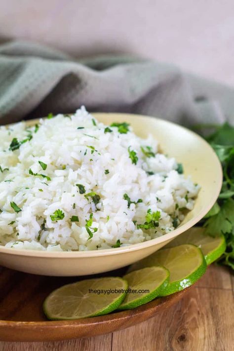 This easy cilantro lime rice recipe will elevate any meal. With just a few ingredients, cilantro lime rice is the perfect, fresh, and delicious side dish! #gayglobetrotter #cilantrolimerice #rice #lime #cilantro #sidedish Instant Pot Cilantro Lime Rice, Chipotle Cilantro Lime Rice, Vegan Thanksgiving Sides, Cilantro Lime Rice Recipe, Lime Rice Recipes, Rice Sides, Cilantro Rice, Eating On A Dime, Lemon Rice