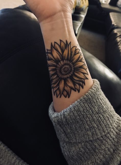 Sunflower tattoo Sunflower Tattoo With Shading, Sunflower Tattoo On Elbow, Knee Sunflower Tattoo, Shaded Sunflower Tattoo, Sunflower Neck Tattoo, Yellow Sunflower Tattoo, Sunflower Hand Tattoo, Name Tattoo Cover Up Ideas, Female Forearm Tattoo Ideas