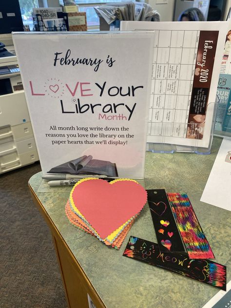 School Library Desk Decor, Library Lovers Month Display, Library Shelfie Day, Valentines Day Book Display, Valentine Library Ideas, February Book Displays, Library Lovers Day, Love Your Library Month Ideas, Valentine’s Day Library Display