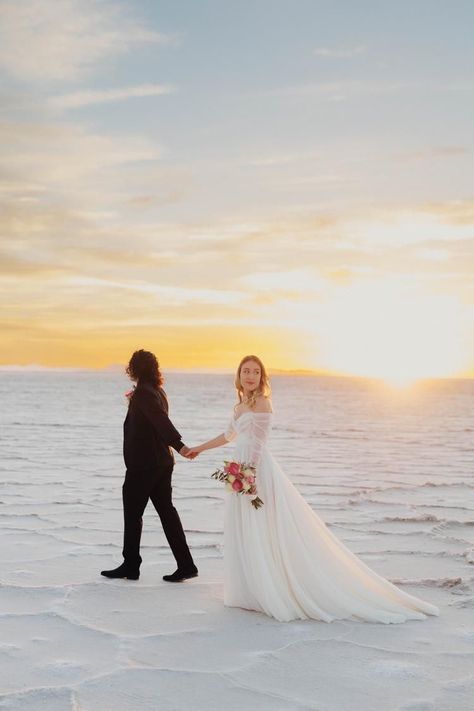 alice shoots people, bonneville salt flats wedding, salt flats elopement, bhldn, @bhldn, bhldn wedding dress, biracial wedding couple, utah elopement, utah elopement photographer, sunrise elopement, where to elope, bride and groom, wedding poses, wedding pose inspo, Bonneville salt flats bridals, off the shoulder wedding dress, bridal pose inspiration, utah wedding photography, utah bridals, wedding dress, pink wedding bouquet, elopement inspo, boho elopement, elopement ideas, groom in black Biracial Wedding, Salt Flats Wedding, Utah Bridals, Wedding Dress Pink, Wedding Dress Aesthetic, Pink Wedding Bouquet, Bridal Pose, Sunrise Elopement, Salt Flat