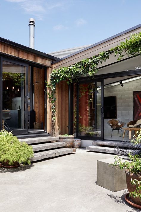 Outdoor, Concrete Patio, Porch, Deck, and Planters Patio, Porch, Deck Ample greenery in the courtyards softens the neutral material palette. Photo 6 of 19 in This New Zealand Architect Created a House That Looks Like a Tiny Village Concrete Wood Patio, Concrete Courtyard, Concrete Courtyard Ideas, Concrete Patio Landscaping Ideas, Concrete Patio Ideas, Concrete Deck, Concrete Patios, Porch Kits, Modern Outdoor Spaces