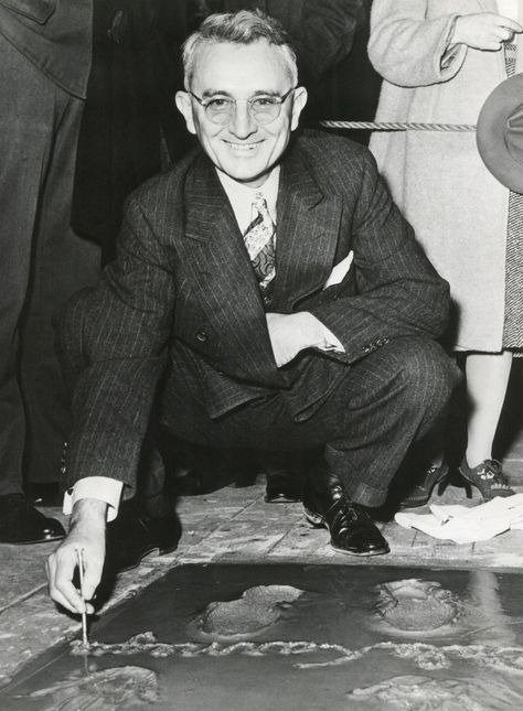 Dale Carnegie, signing his concrete slab at Grauman's Chinese Theatre. His book, 'How To Win Friends and Influence People' of 1936 is a classic and still relevant self-help book. Dale was born on November 24, 1888 in Maryville, Missouri. Image via Alamy Maryville Missouri, Influence People, Chinese Theatre, Dale Carnegie, How To Influence People, Concrete Slab, Self Help Book, Missouri, Self Help