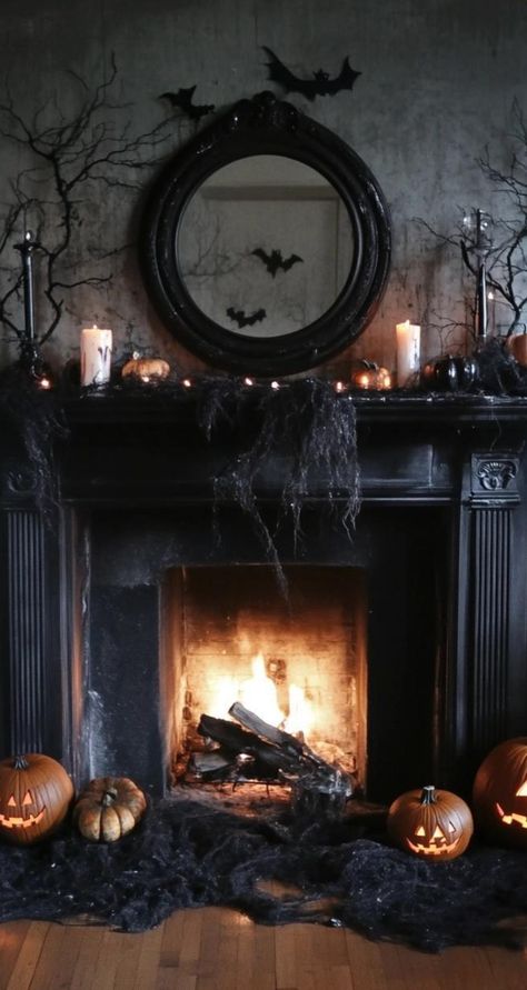 Transform your space with minimalist Halloween decor that embraces negative space and geometric shapes. Create a striking wall display using black paper cutouts of classic Halloween symbols like cats, bats, and crescent moons. Arrange slender black candlesticks of varying heights on a mantel, their clean lines casting dramatic shadows. Place a single, oversized white pumpkin in a corner for a bold focal point. These streamlined Halloween decorations demonstrate that a few well-chosen elements ca Black Fireplace Halloween Decor, Halloween Mantle Ideas, Minimalist Halloween Decor, Minimalist Decor Ideas, Sophisticated Halloween, Bat Display, Black Candlesticks, Halloween Food Dinner, Halloween Fireplace