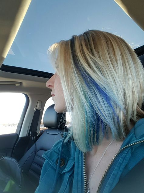 Blonde And Blue Short Hair, Peekaboo Highlights Medium Length Hair, Blue Peak A Boo Hair Blonde, Blonde Hair Blue Peekaboo, Bob Haircut With Color Underneath, Angled Bob With Peekaboo Highlights, Blue Ends On Blonde Hair, Blonde And Turquoise Hair Highlights, Peek A Boo Color