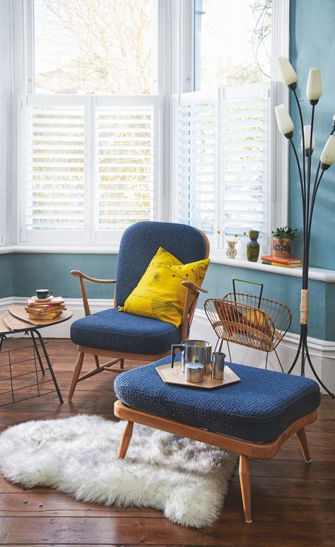 An Ercol chair and matching footstool Ercol Armchair, Upcycle Chair, Ercol Chair, Ercol Furniture, Calming Bedroom, Designer Bar Stools, The 40s, Yellow Cushions, Iconic Furniture