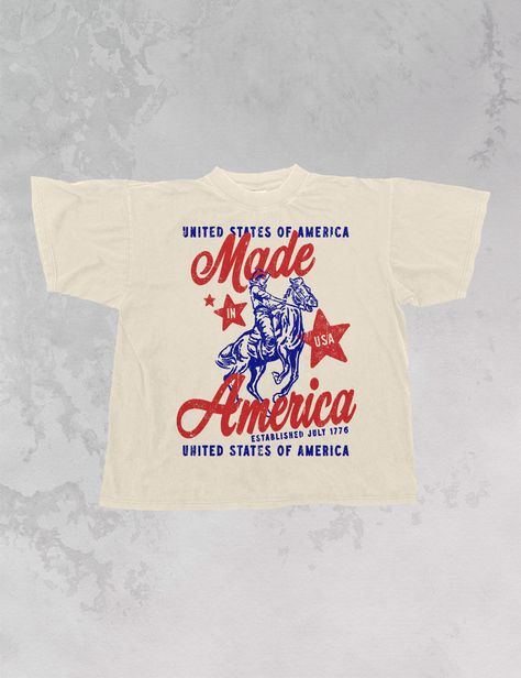 Show off that you're Made in America in our retro USA oversized t-shirt - Features "Made in America" with a man riding a horse and "Unites States of America" above and below all in red and blue ink - Screen Print transfer that is heat pressed onto each tshirt - Tshirt is a super soft vintage wash that gets softer after each wash - Oversized fit - Sizing translation: XS/S = L , S/M = XL , L/XL = 2XL , 2XL/3XL = 3XL - 100% Cotton **due to screens & filters color may vary from pictures** Country Concert Tshirts, Vintage Tshirt Design Ideas, Tshirt Screen Printing Ideas, Vintage Usa Shirt, Conference Tshirt Design, Screen Print Tshirt Design, Usa T Shirt Design, Cute Graphic Tees Aesthetic, Western Oversized Tshirt