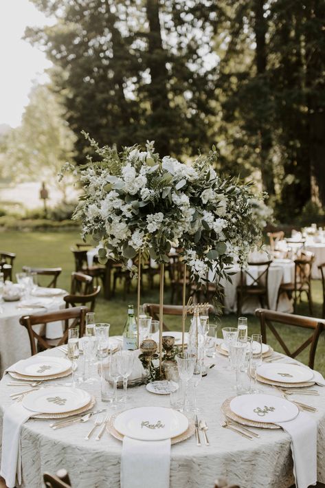 Contemporary Wedding Centerpieces, White And Gold Wedding Themes Outdoor, White And Ivory Wedding Table Place Settings, Classic Wedding Round Table Decor, Wedding White And Greenery, Ivory Flowers Wedding Centerpieces, White And Green Outdoor Wedding Decor, Ivory And Green Wedding Flowers, White Wedding Place Settings