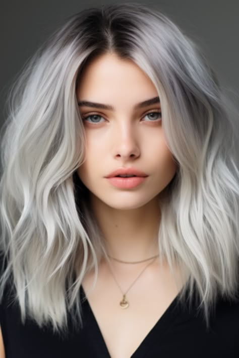 The choppy silver lob with dark roots offers an edgy, yet sophisticated style. By keeping the roots dark, this look provides a low-maintenance yet high-impact effect. Click here to check out more stunning silver hair color ideas for 2023. Silver Grey Hair With Shadow Root, White Hair With Root Smudge, Frosted Silver Hair, Gray Hair Shadow Root, Silver Hair Brown Roots, Silver With Dark Roots, White Hair With Roots, Grey Hair With Shadow Root, Silver Blonde Hair Dark Roots