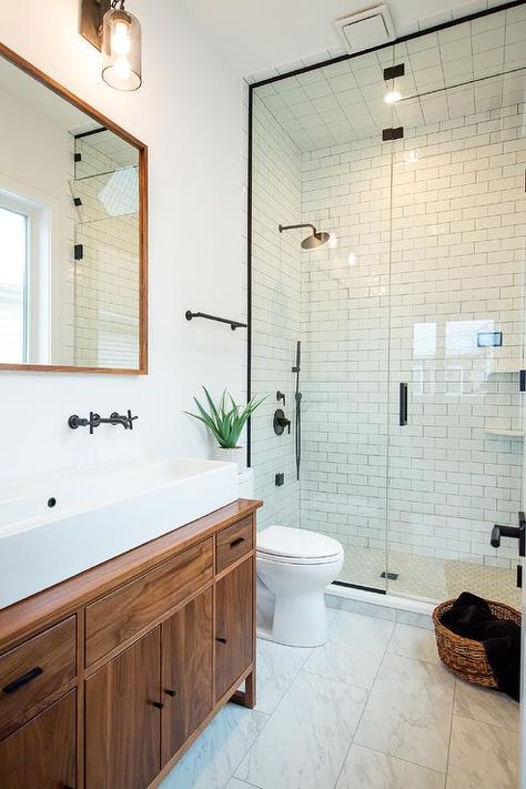 White Tile Wood Vanity Bathroom, All White Bathroom With Black Fixtures, White Subway Tile Black Fixtures, Bathroom Remodel Brown Vanity, Bathroom Black Fixtures Wood Vanity, Black Wood White Bathroom, Wood White And Black Bathroom, Black And White Subway Tile Bathroom Ideas, Bathroom Black Floor Wood Vanity