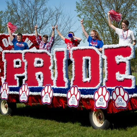 Show your pride by choosing our Parade Float PRIDE Letter Set as part of your float design. You will choose your letter color, vinyl twistee color and outside border color for this free-standing Parade Float PRIDE Letter Set. Set of 5 3D letters Made of cardboard and vinyl Measures 3' 6" high x 13' wide x 10" deep Assembly required Cheer Homecoming, Parade Float Theme, Sports Vbs, Parade Float Ideas, Homecoming Decorations, Parade Float Supplies, Homecoming Floats, Football Banquet, Spirit Days