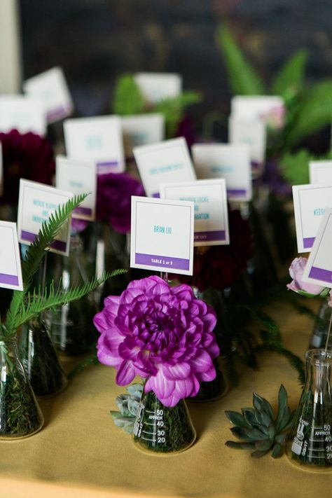 Glass beaker escort cards styled with colorful flowers, moss, succulents, and greenery for a science inspired wedding at Terra Gallery in San Francisco by destination wedding planner Mango Muse Events Beaker Flower Arrangements, Science Bridal Shower Ideas, Science Wedding Centerpieces, Science Event Decor, Science Wedding Ideas, Science Themed Centerpieces, Beaker Decor, Science Wedding Theme, Science Themed Wedding