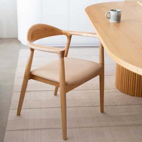 Have you met Monty? Taking cues from Scandinavian design, the Monty Dining Chair is an adaptation of the Miller Dining Chair with a Nude PU Leather Seat. Comfort is guaranteed for extended periods thanks to the specially designed curved backrest that smoothly transitions into the design of the arms. This low-profile chair slides easily under your dining table for a minimalist style. In-stock and ready for your home. ❤️ Scandinavian Dining Table, Furniture Showroom, European Linens, Linen Cushion, Australian Design, Ash Wood, Adaptation, Leather Seat, Minimalist Style