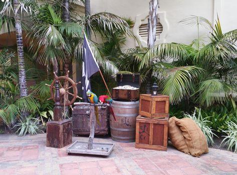 Pirate theme corporate event design and pirate theme props for rent for corporate events, picture of cannons and barrels and flags Pirate Halloween Party, Pirate Props, Pirate Stuff, Corporate Event Design, Pirate Decor, Barrel Decor, Pirates Life, Jungle Cruise, Pirate Halloween