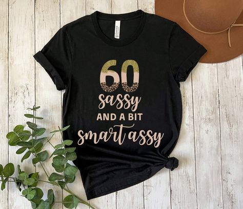 If you're looking for funny 60th birthday gifts for women, this super cute 60th birthday shirt is perfect! This sixty sassy and a bit smart assy tee makes a great best friend 60th birthday gift and an awesome 60th shirt to wear for your sixtieth birthday party and all year long! **PLEASE NOTE: THE GLITTER IS A PRINTED DESIGN AND *NOT* REAL GLITTER** Funny 60th Birthday Gifts, 60th Birthday Gifts For Women, Funny 60th Birthday, Sixtieth Birthday, Zodiac Shirts, 60th Birthday Gifts, 60th Birthday, Birthday Gifts For Women, Birthday Shirts