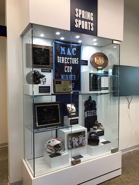 The Potomac School trophy case build; Dimensional letter graphics and build. Large format graphics.  McLean, VA School Trophy Case Ideas, School Trophy, Trophy Cabinets, Trophy Display Case, Sport Rack, Trophy Display, School Hall, Trophy Case, Wall Of Fame