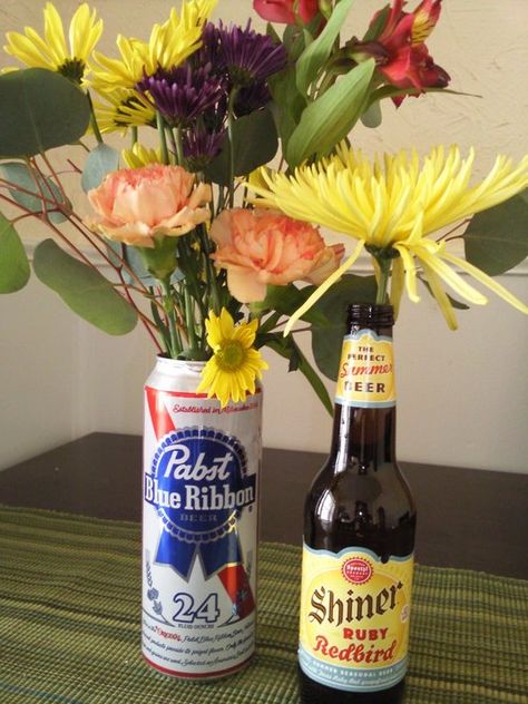 beer flowers Beer Can Flower Vase, Beer Can Vase, Beer Can Centerpieces Table Decorations, Beer Can Flowers, Beer Bottle Flower Vase, Beer Can Centerpieces, Beer Bucket Centerpiece, 50th Birthday Party Men, Beer Bottle Vase